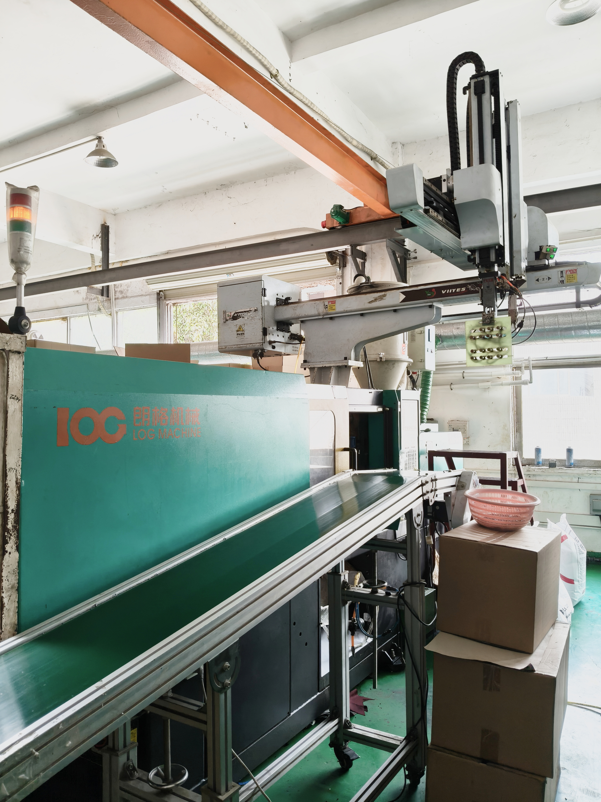 Injection molding workshop area with advanced manufacturing equipment